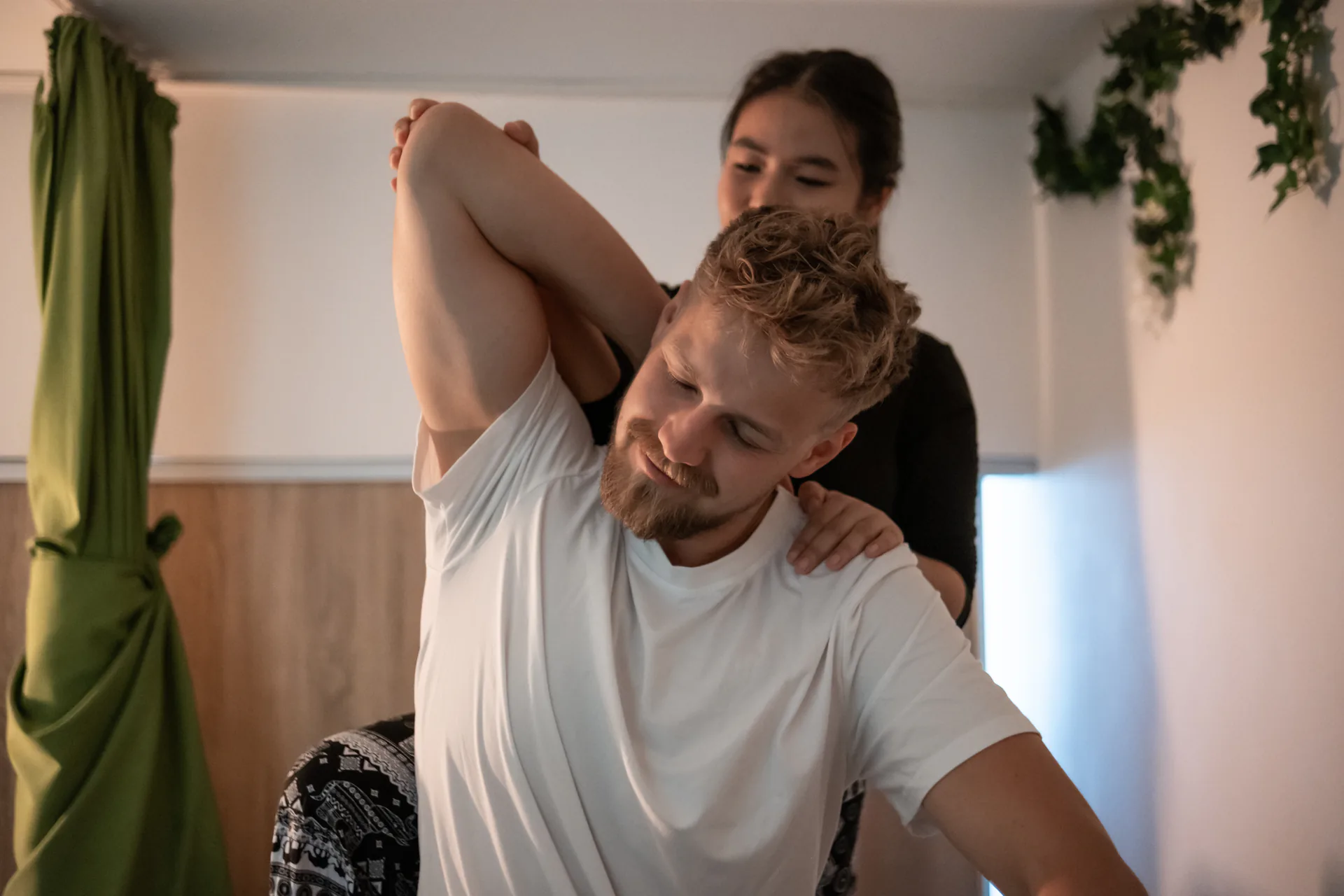 Traditional Thai shoulder stretch treatment in the salon